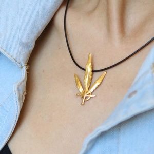 Real Cannabis leaf pendant in colored silver
